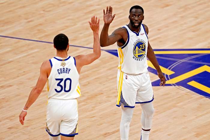 Jun 13, 2022; San Francisco, California, USA; Golden State Warriors forward Draymond Green (23) celebrates with Golden State Warriors guard Stephen Curry (30) during the first quarter against the Boston Celtics in game five of the 2022 NBA Finals at Chase Center. Mandatory Credit: Cary Edmondson-USA TODAY Sports